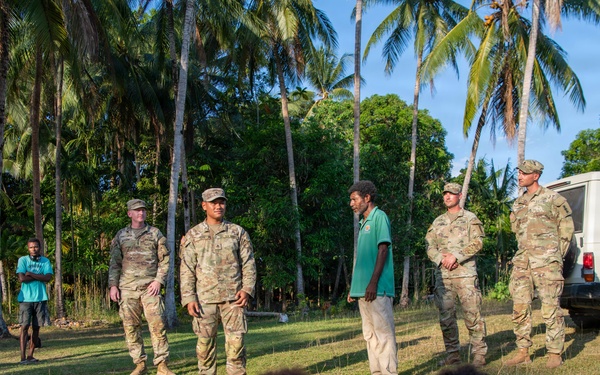 U.S. Army Soldiers donate toys, musical instruments, and literature material to the youth of a local village during Tamiok Strike 26