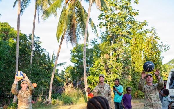 U.S. Army Soldiers donate toys, musical instruments, and literature material to the youth of a local village during Tamiok Strike 26