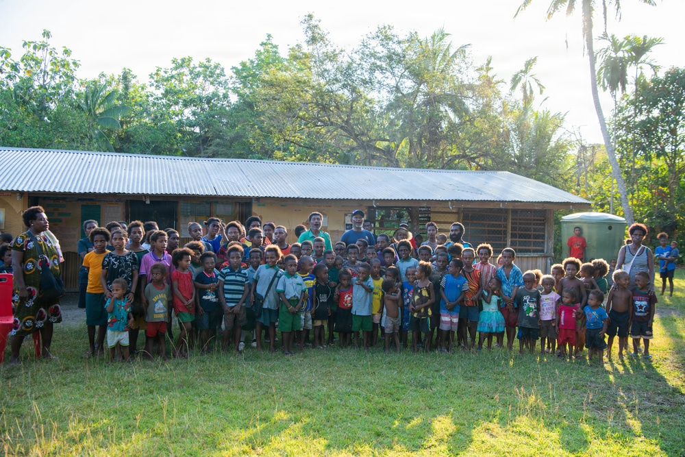 U.S. Army Soldiers donate toys, musical instruments, and literature material to the youth of a local village during Tamiok Strike 26