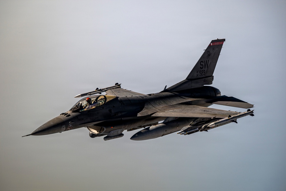 KC135 refuels F16s during routine patrol