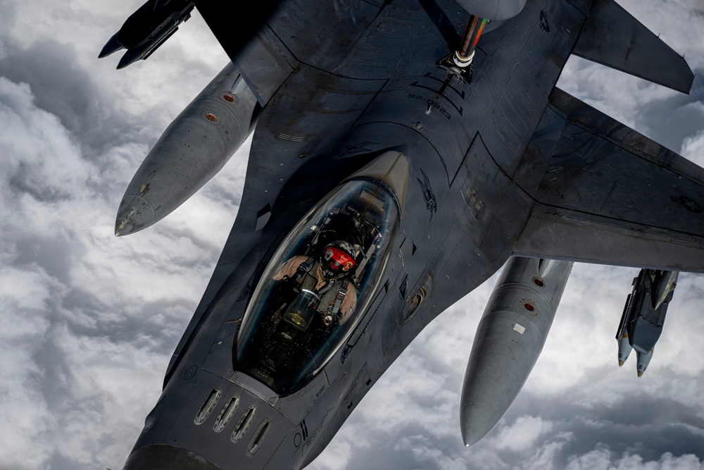 KC135 refuels F16s during routine patrol