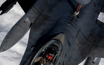 KC135 refuels F16s during routine patrol