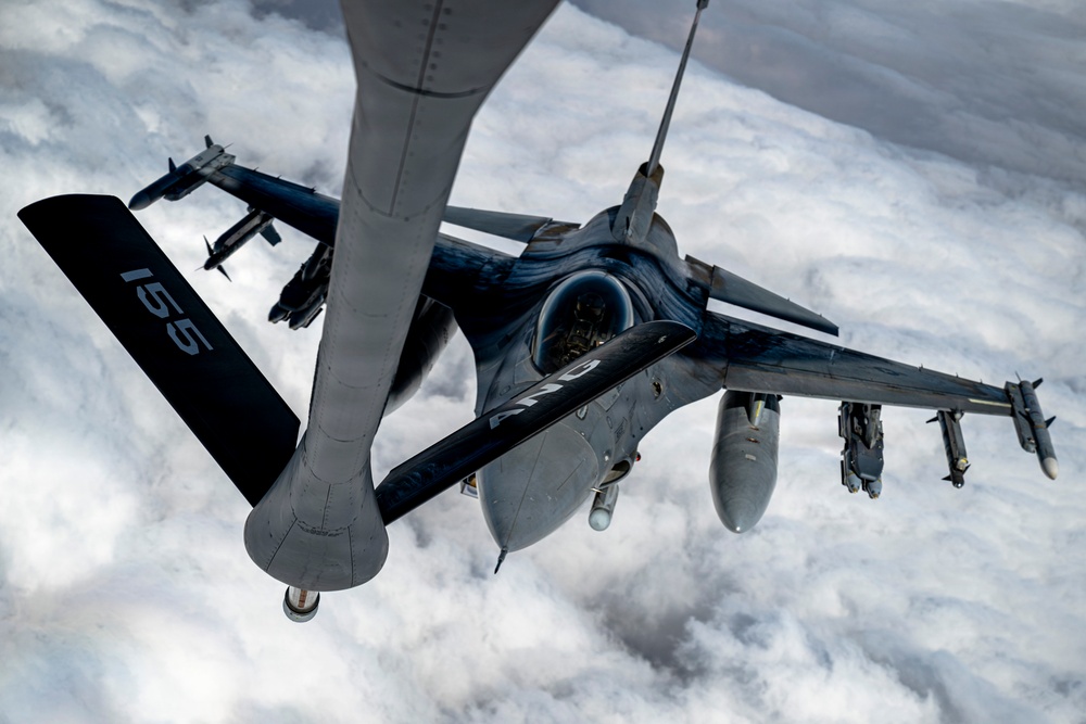 KC135 refuels F16s during routine patrol