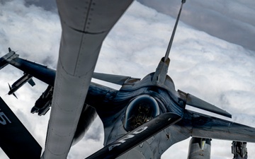 KC135 refuels F16s during routine patrol