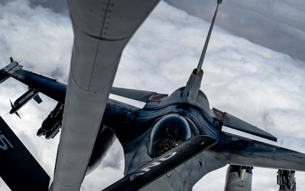 KC135 refuels F16s during routine patrol