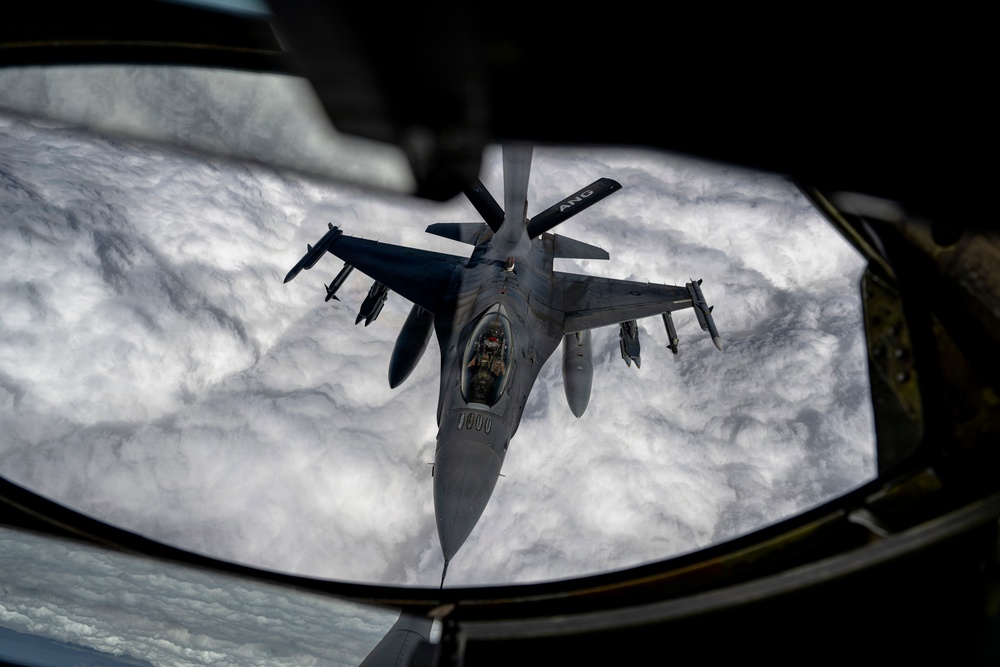 KC135 refuels F16s during routine patrol