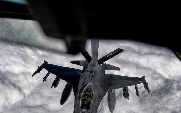 KC135 refuels F16s during routine patrol