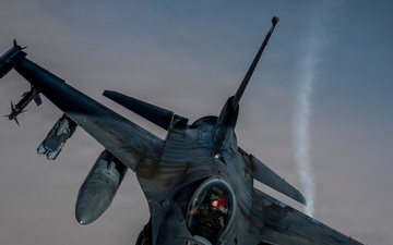 KC135 refuels F16s during routine patrol