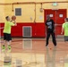 U.S. Marines and local community members participate in a pickup basketball game