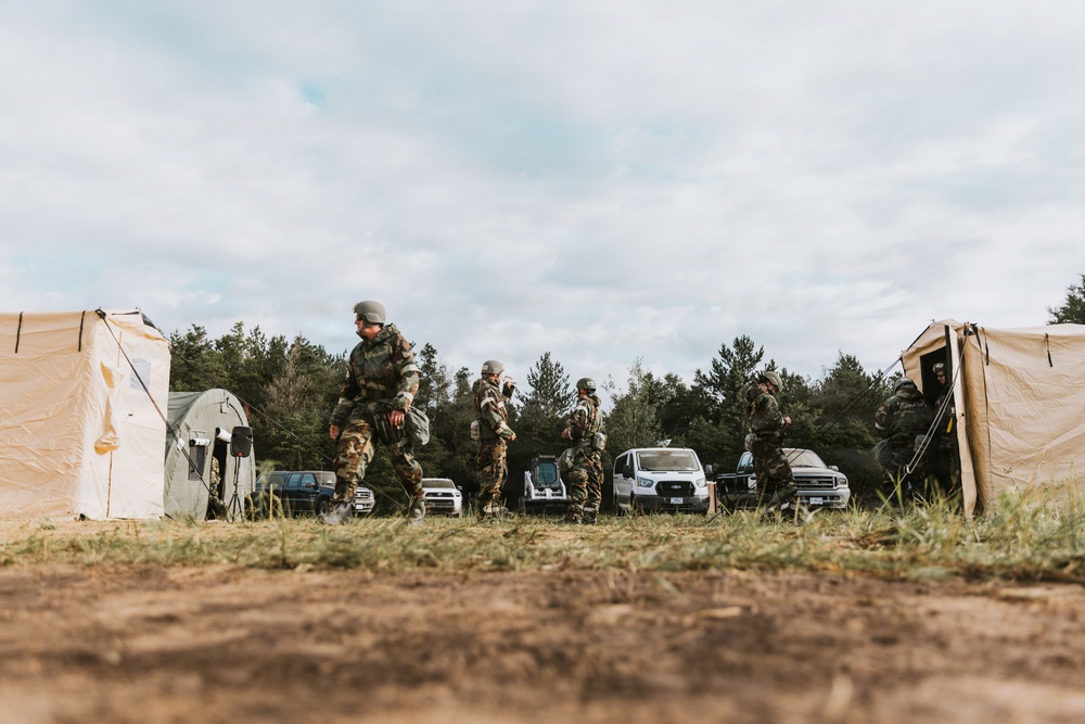 Airmen from the 131st Civil Engineer Squadron and the 139th Civil Engineer Squadron perform tasks in MOPP gear