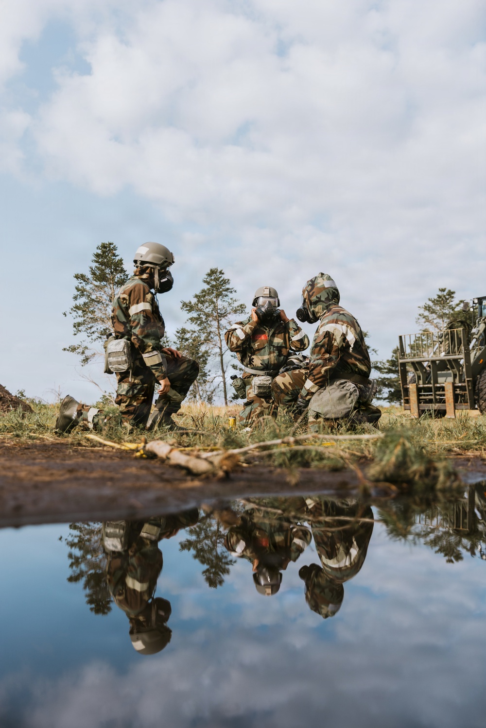 Airmen from the 131st Civil Engineer Squadron and the 139th Civil Engineer Squadron perform tasks in MOPP gear