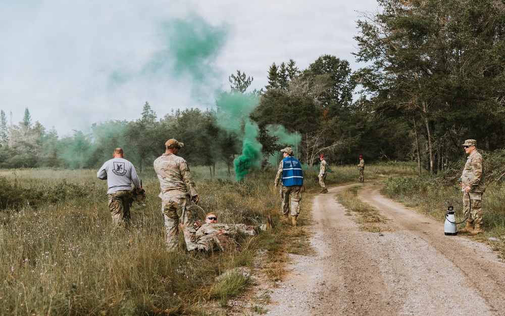 Airmen from the 131st Civil Engineer Squadron and the 139th Civil Engineer Squadron perform tasks in MOPP gear