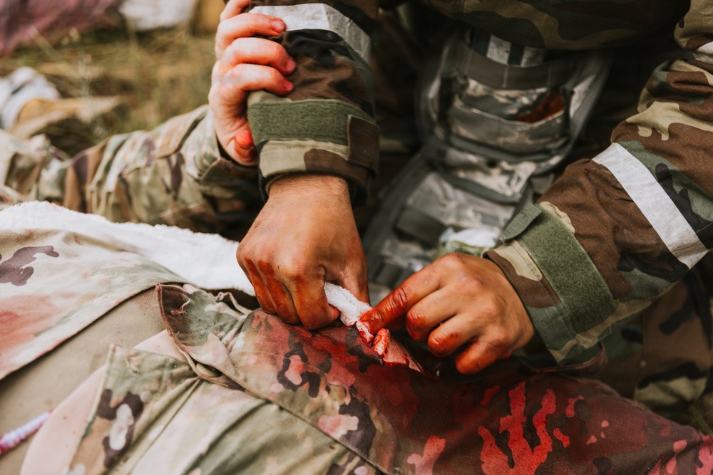 Airmen from the 131st Civil Engineer Squadron and the 139th Civil Engineer Squadron perform tasks in MOPP gear