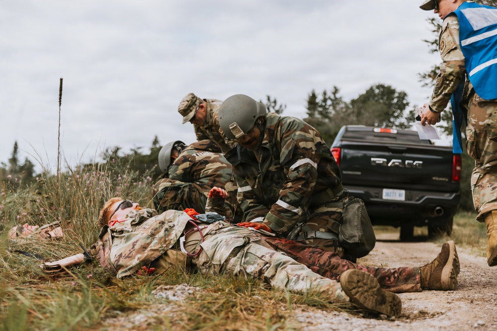Airmen from the 131st Civil Engineer Squadron and the 139th Civil Engineer Squadron perform tasks in MOPP gear