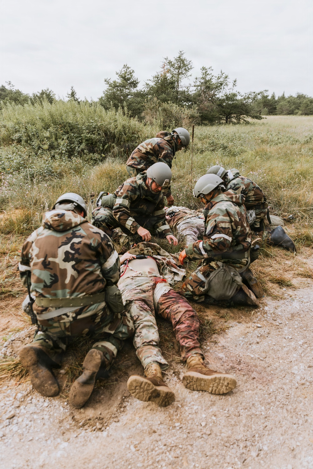 Airmen from the 131st Civil Engineer Squadron and the 139th Civil Engineer Squadron perform tasks in MOPP gear