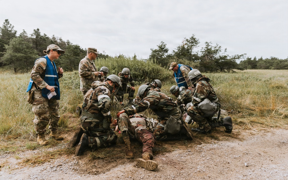 Airmen from the 131st Civil Engineer Squadron and the 139th Civil Engineer Squadron perform tasks in MOPP gear