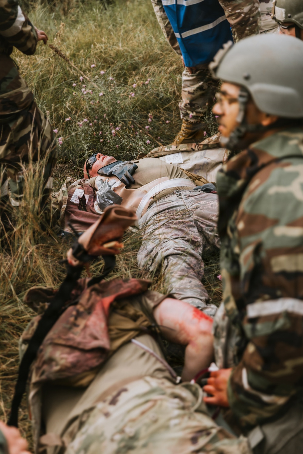 Airmen from the 131st Civil Engineer Squadron and the 139th Civil Engineer Squadron perform tasks in MOPP gear