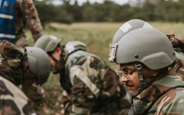 Airmen from the 131st Civil Engineer Squadron and the 139th Civil Engineer Squadron perform tasks in MOPP gear