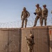 591st Engineer Company places Concertina Wire on top of HESCO barriers at NDA 2