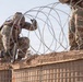 591st Engineer Company places Concertina Wire on top of HESCO barriers at NDA 2