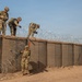 591st Engineer Company places Concertina Wire on top of HESCO barriers at NDA 2