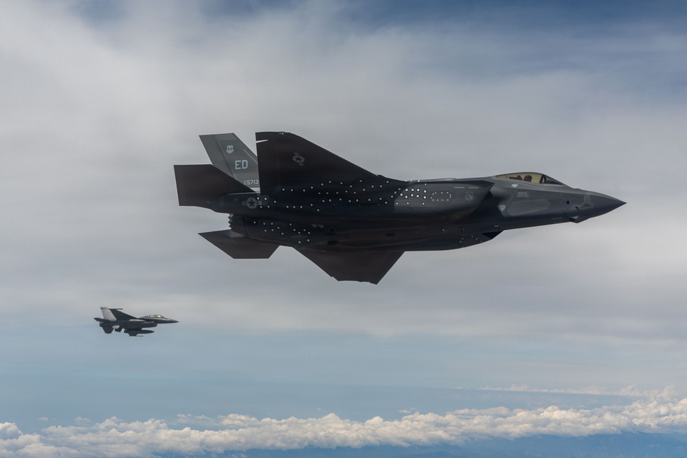 Edwards F-35A and F-16 soar over the sea test range