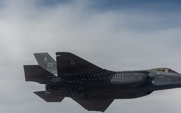 Edwards F-35A and F-16 soar over the sea test range
