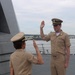 Captain Mary Hays, Commanding Officer, USS Ted Stevens (DDG 128), promotes Weapons Officer, LT Zachary Wasson, to the rank of Lieutenant Commander.