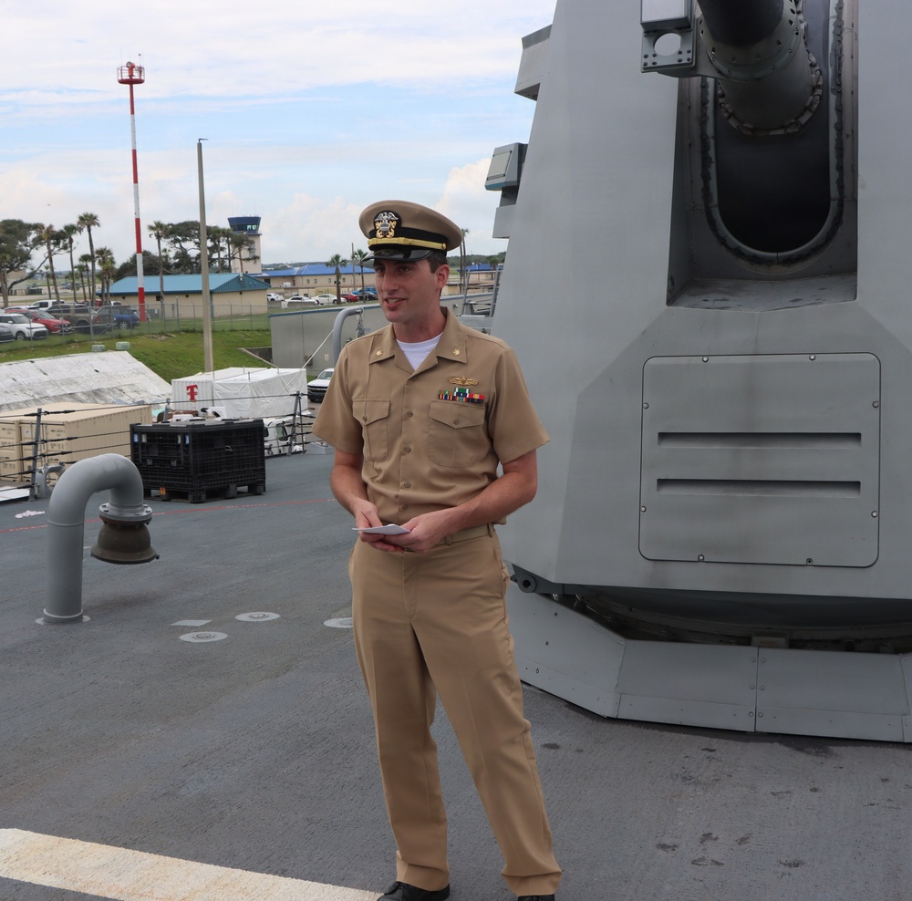 Captain Mary Hays, Commanding Officer, USS Ted Stevens (DDG 128), promotes Weapons Officer, LT Zachary Wasson, to the rank of Lieutenant Commander.