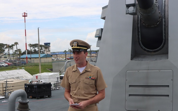 Captain Mary Hays, Commanding Officer, USS Ted Stevens (DDG 128), promotes Weapons Officer, LT Zachary Wasson, to the rank of Lieutenant Commander.