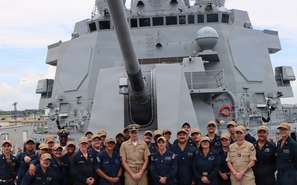 Captain Mary Hays, Commanding Officer, USS Ted Stevens (DDG 128), promotes Weapons Officer, LT Zachary Wasson, to the rank of Lieutenant Commander.