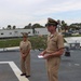 Captain Mary Hays, Commanding Officer, USS Ted Stevens (DDG 128), promotes Weapons Officer, LT Zachary Wasson, to the rank of Lieutenant Commander.
