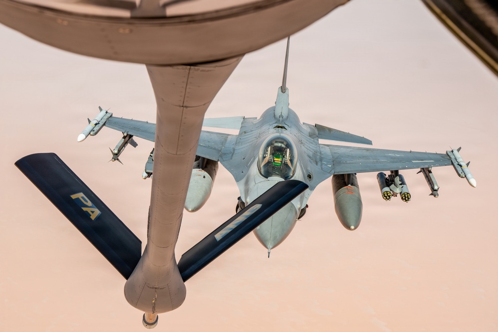 KC-135 refuels F16s for theater stability