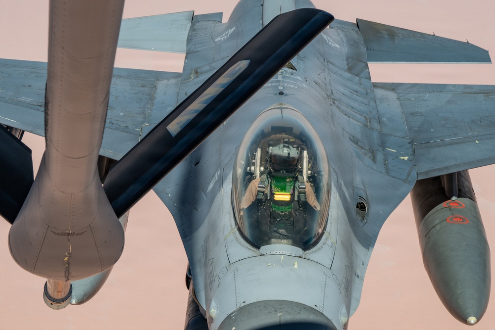 KC-135 refuels F16s for theater stability