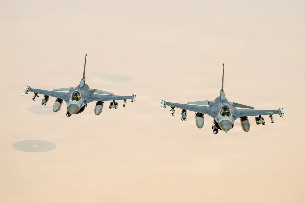 KC-135 refuels F16s for theater stability