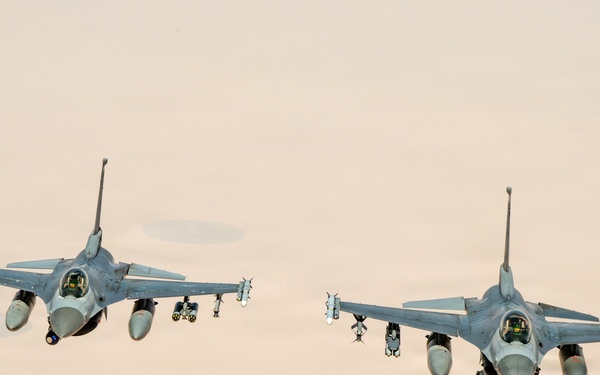 KC-135 refuels F16s for theater stability