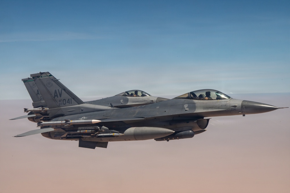 KC-135 refuels F16s for theater stability