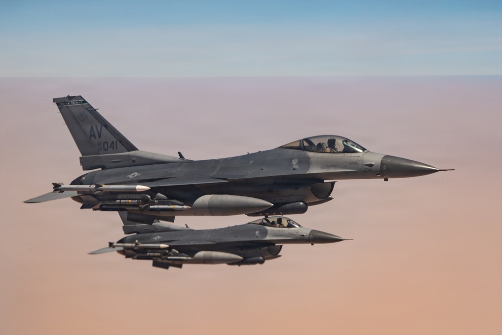 KC-135 refuels F16s for theater stability