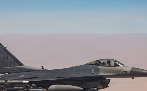 KC-135 refuels F16s for theater stability