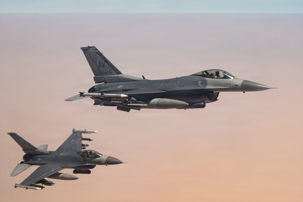 KC-135 refuels F16s for theater stability
