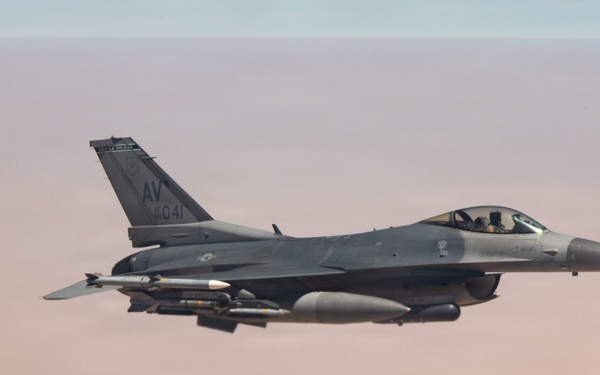 KC-135 refuels F16s for theater stability