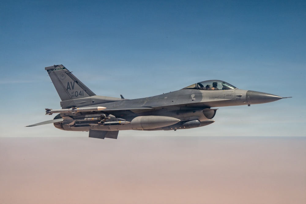 KC-135 refuels F16s for theater stability