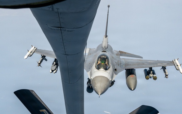 KC-135 refuels F16s for theater stability