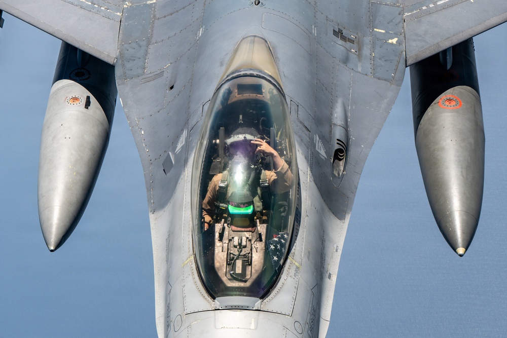 KC-135 refuels F16s for theater stability
