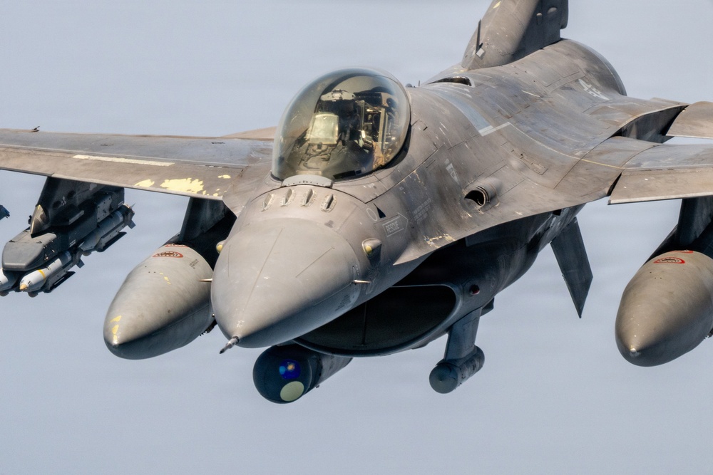 KC-135 refuels F16s for regional stability