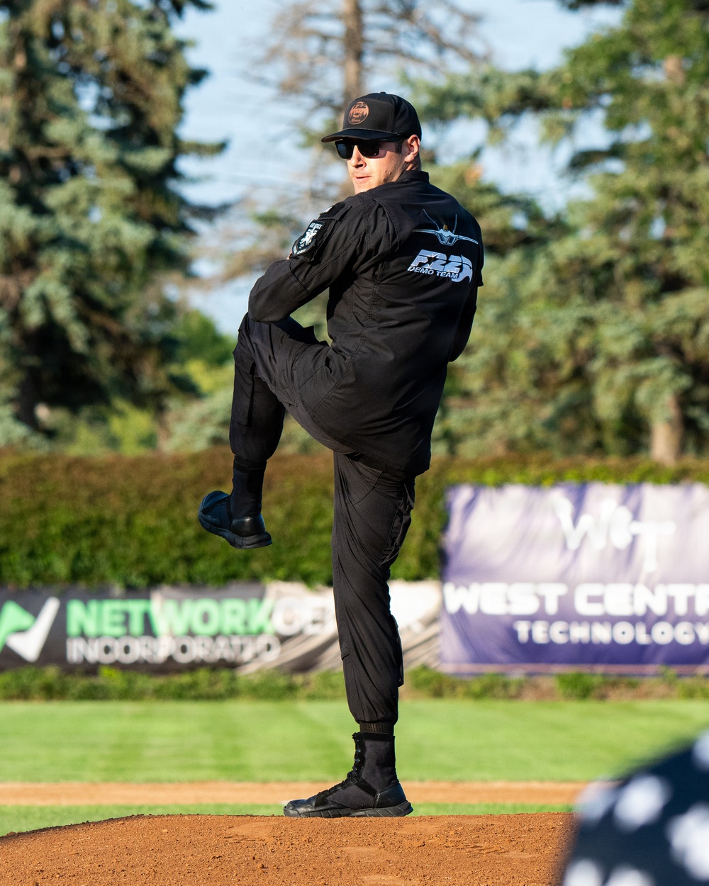 F-22 Demonstration Team crew chief throws the first pitch for the St. Cloud Rox