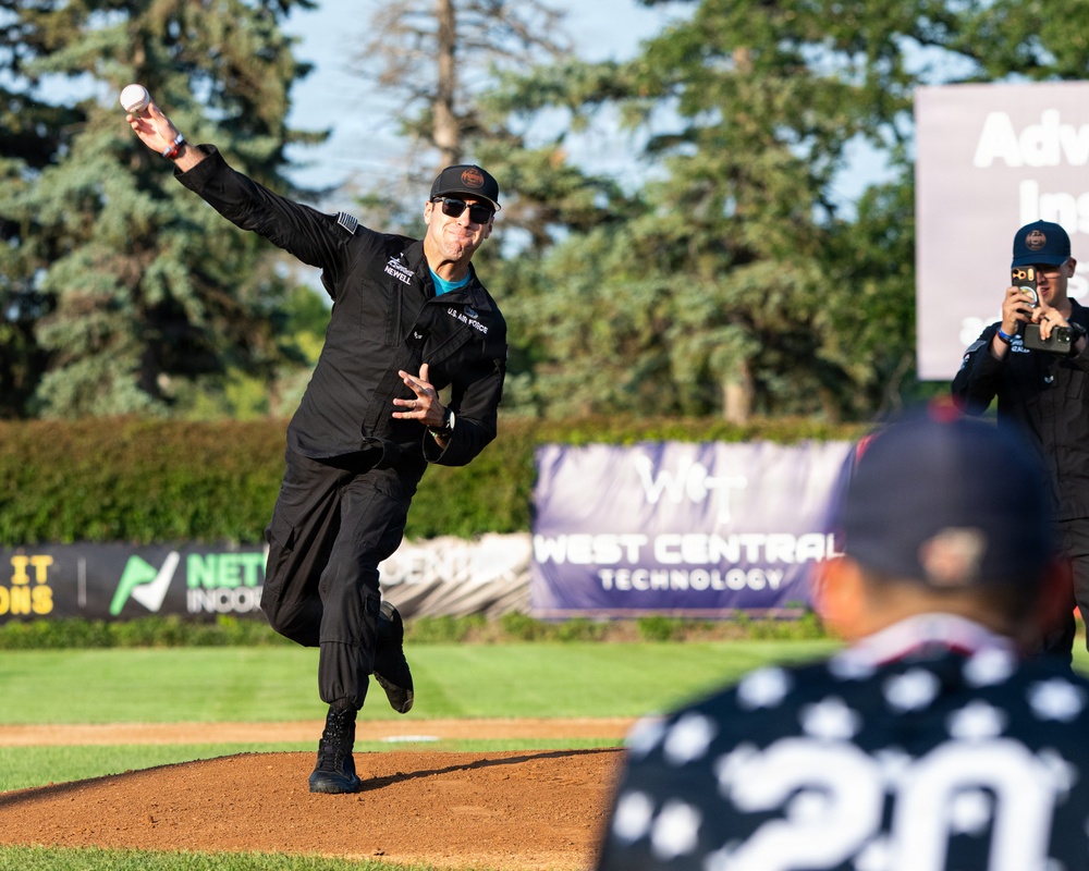 F-22 Demonstration Team crew chief throws the first pitch for the St. Cloud Rox