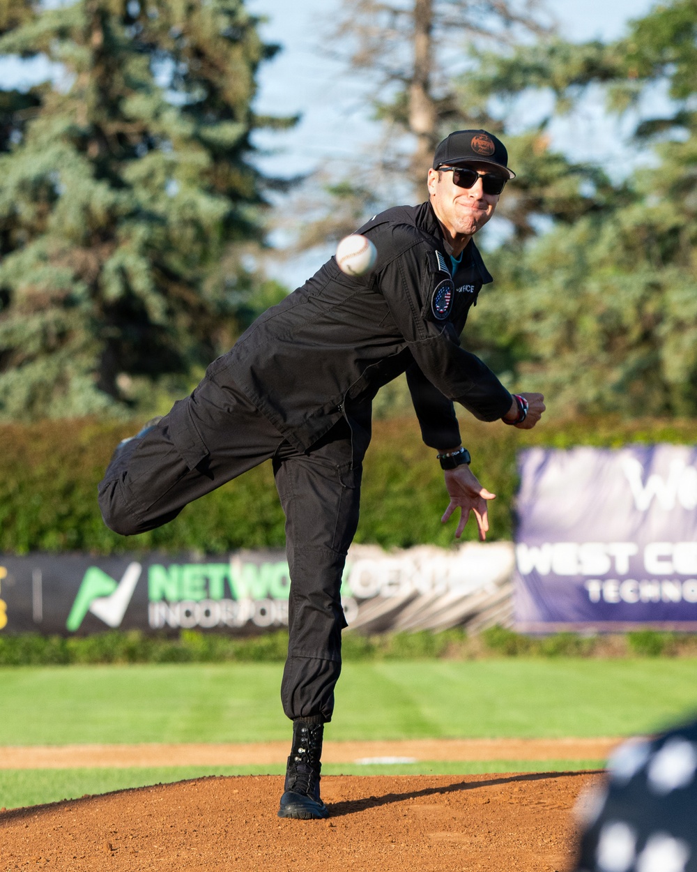 F-22 Demonstration Team crew chief throws the first pitch for the St. Cloud Rox