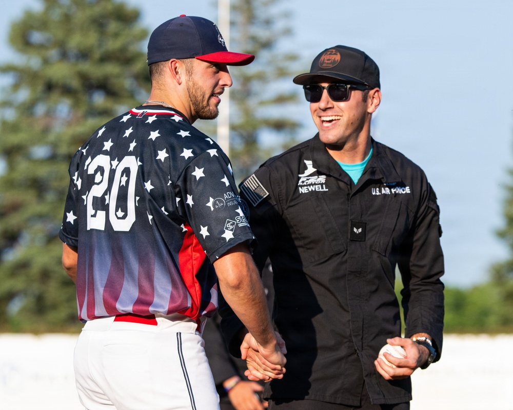 F-22 Demonstration Team crew chief throws the first pitch for the St. Cloud Rox