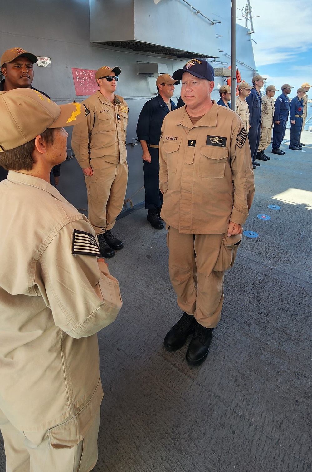 Chaplain Judson Dunlap is rung ashore having completed his assignment onboard USS Ted Stevens (DDG 128).